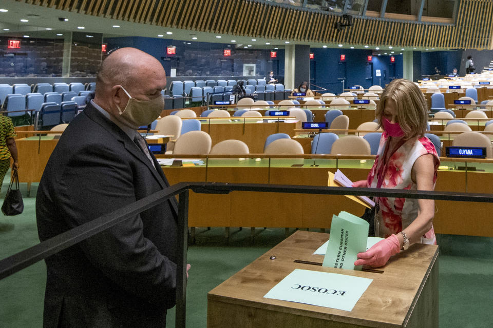 Norway's ambassador to the United Nations, Mona Juul, casts a vote during U.N. elections, Wednesday, June 17, 2020, at U.N. headquarters in New York. Norway and Ireland won contested seats on the powerful U.N. Security Council Wednesday in a series of U.N. elections held under dramatically different voting procedures because of the COVID-19 pandemic. (Eskinder Debebe/UN Photo via AP)
