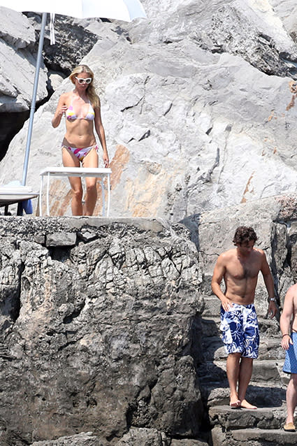 Looks like Gwyneth Paltrow and boyfriend Brad Falchuk are still going strong. The 42-year-old actress soaked up the sun with Ryan Murphy's 44-year-old producing partner in the Italian resort town of Positano on Sunday, where they both showed off their super-fit physiques. Gwyneth looked amazing in a colorful Pucci bikini, while Brad showed off his abs, going shirtless in blue-and-white board shorts. AKM/GSI <strong>WATCH: Gwyneth Paltrow Dishes On All Her Exes -- Brad Pitt Was 'Too Good For Me'</strong> Both of them showed off their more adventurous sides, jumping into the sea, and also showed some PDA while lounging together and working on their tans. AKM/GSI The couple was snapped in Rome last week, and Gwyneth has shared some pics of her Italian vacay on Instagram -- sans Brad, of course. The Goop founder even found the time to make her own pasta during her romantic getaway. "When in Rome ... make your own pasta! Chef Rosa had me blend the egg with basil before I mixed with flour... Green tagliolini Served with a simple sauce of blanched Roma tomatoes and fresh burrata," she wrote. Gwyenth and Brad have been linked together since last July, but have largely kept under the radar. Gwyneth announced her separation from her ex, Chris Martin, last March. WATCH: Gwyneth Paltrow Says 'Nothing Ruled Out' of Her Diet While Showing Off Amazing Bikini Body Check out how Gwyneth and Chris have kept it amicable for their two kids, 11-year-old Apple and 9-year-old Moses, while moving on with their respective love lives -- Chris with Oscar- winning actress Jennifer Lawrence -- in the video below.