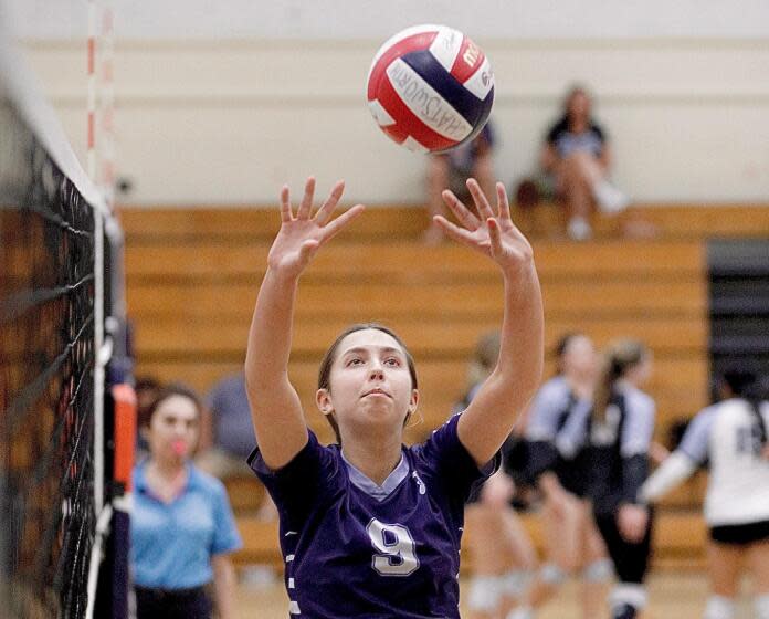 Palisades' Rowan Williams sets a teammate.