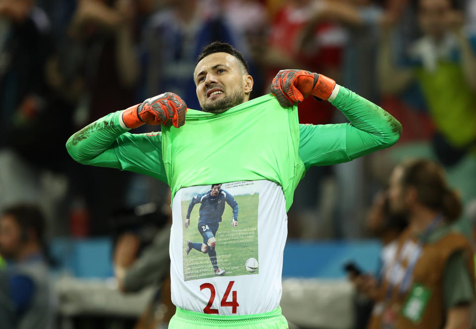 Danijel Subašić pulls his goalkeeping shirt over his head to pay tribute to his late friend and team-mate