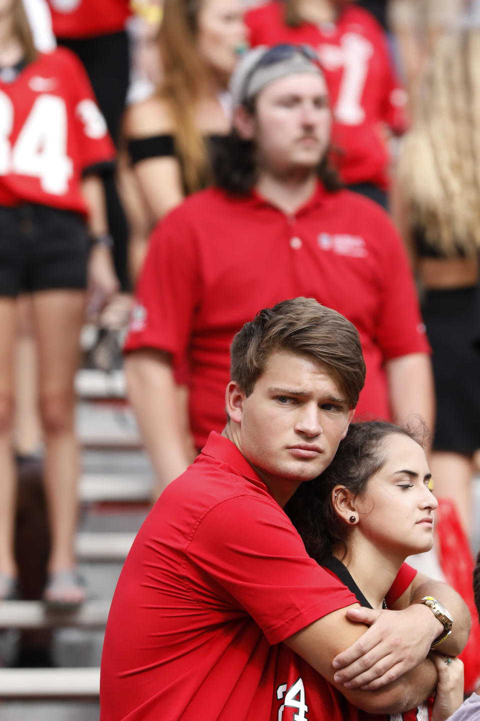 Georgia fans react after the Bulldogs lost 20-17 in double overtime to unranked South Carolina in an NCAA college football game in Athens, Ga., on Saturday, Oct. 12, 2019. (Joshua L. Jones/Athens Banner-Herald via AP)