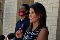 Former South Carolina Gov. Nikki Haley, right, speaks with reporters after a tour of the campus of South Carolina State University on Monday, April 12, 2021, in Orangeburg, S.C. Haley, often mentioned as a possible 2024 GOP presidential contender, said Monday that she would not seek her party's nomination if former President Donald Trump opts to run a second time. (AP Photo/Meg Kinnard)