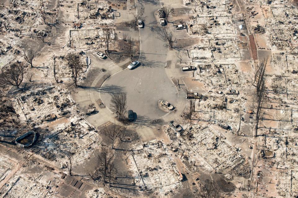 <p>In this aerial view, burned properties are seen in Santa Rosa, Calif., on Oct. 12, 2017. (Photo: Josh Edelson/AFP/Getty Images) </p>