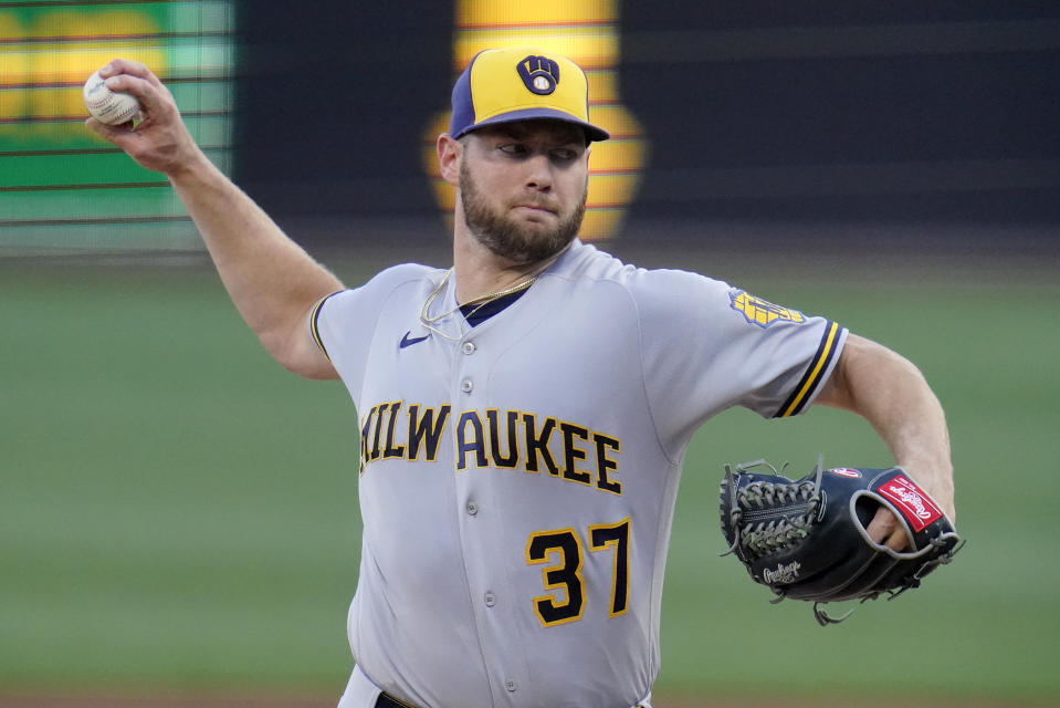 Milwaukee Brewers starting pitcher Adrian Houser delivers during the first inning of the team's baseball game against the Pittsburgh Pirates in Pittsburgh, Thursday, June 30, 2022. (AP Photo/Gene J. Puskar)