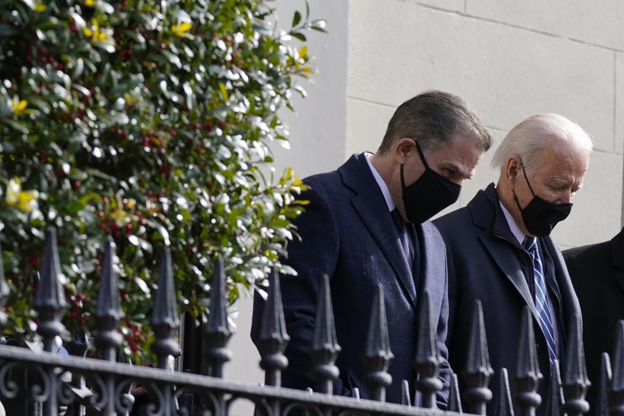 President Joe Biden and his son Hunter depart after attending Mass at Holy Trinity Catholic Church, Sunday, Jan. 24, 2021, in the Georgetown neighborhood of Washington. (AP Photo/Patrick Semansky)