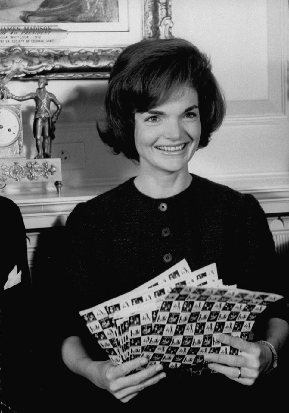 1962: Jackie Kennedy shows off the Christmas seals