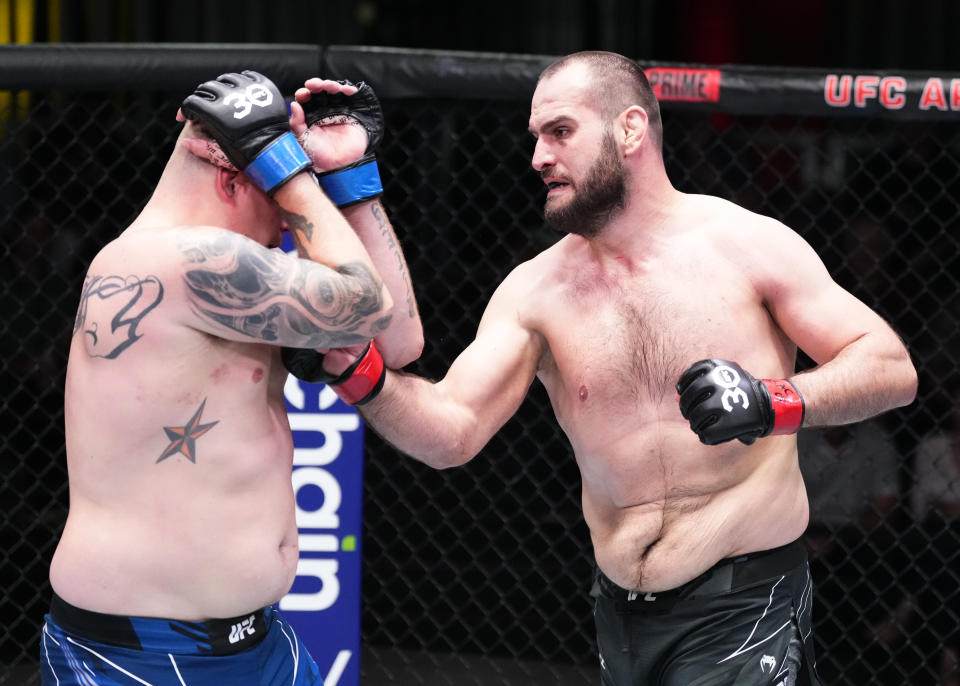 LAS VEGAS, NEVADA – APRIL 29: (R-L) Martin Buday of Slovakia punches Jake Collier in a heavyweight fight during the UFC Fight Night event at UFC APEX on April 29, 2023 in Las Vegas, Nevada. (Photo by Jeff Bottari/Zuffa LLC via Getty Images)