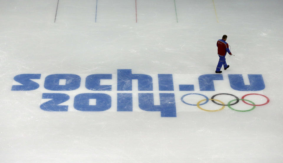 FILE - This is a Saturday, Jan. 25, 2014, file photo of a worker leaves after checking ice conditions at the Iceberg Skating Palace, where the figure skating and short track speed skiing will take place, at the 2014 Winter Olympics in Sochi, Russia. The Olympics begin Feb. 7th. You'd have to be a dope to try to get away with doping at the Sochi Olympics. That's the picture painted by international Olympic and anti-doping officials as they implement the toughest drug-testing program in Winter Games history.Using intelligence to target athletes and events considered most at risk, authorities are focusing their efforts on weeding out drug cheats through rigorous pre-games and pre-competition tests. (AP Photo/David J. Phillip, File)