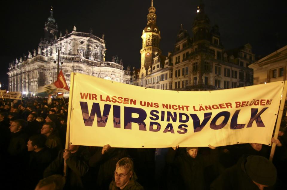 Participants hold a banner during a demonstration called by anti-immigration group PEGIDA, a German abbreviation for "Patriotic Europeans against the Islamization of the West", in Dresden