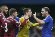 Chelsea's Branislav Ivanovic (R) argues with West Ham United's Adrian (2nd R) and Aaron Cresswell (2nd L) during their English Premier League soccer match at Stamford Bridge in London, December 26, 2014. REUTERS/Stefan Wermuth