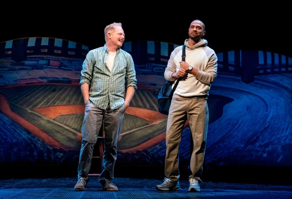 This image released by Polk & Co. shows Jesse Tyler Ferguson, left, and Jesse Williams during a performance of the Broadway revival of the baseball-themed "Take Me Out," in New York.