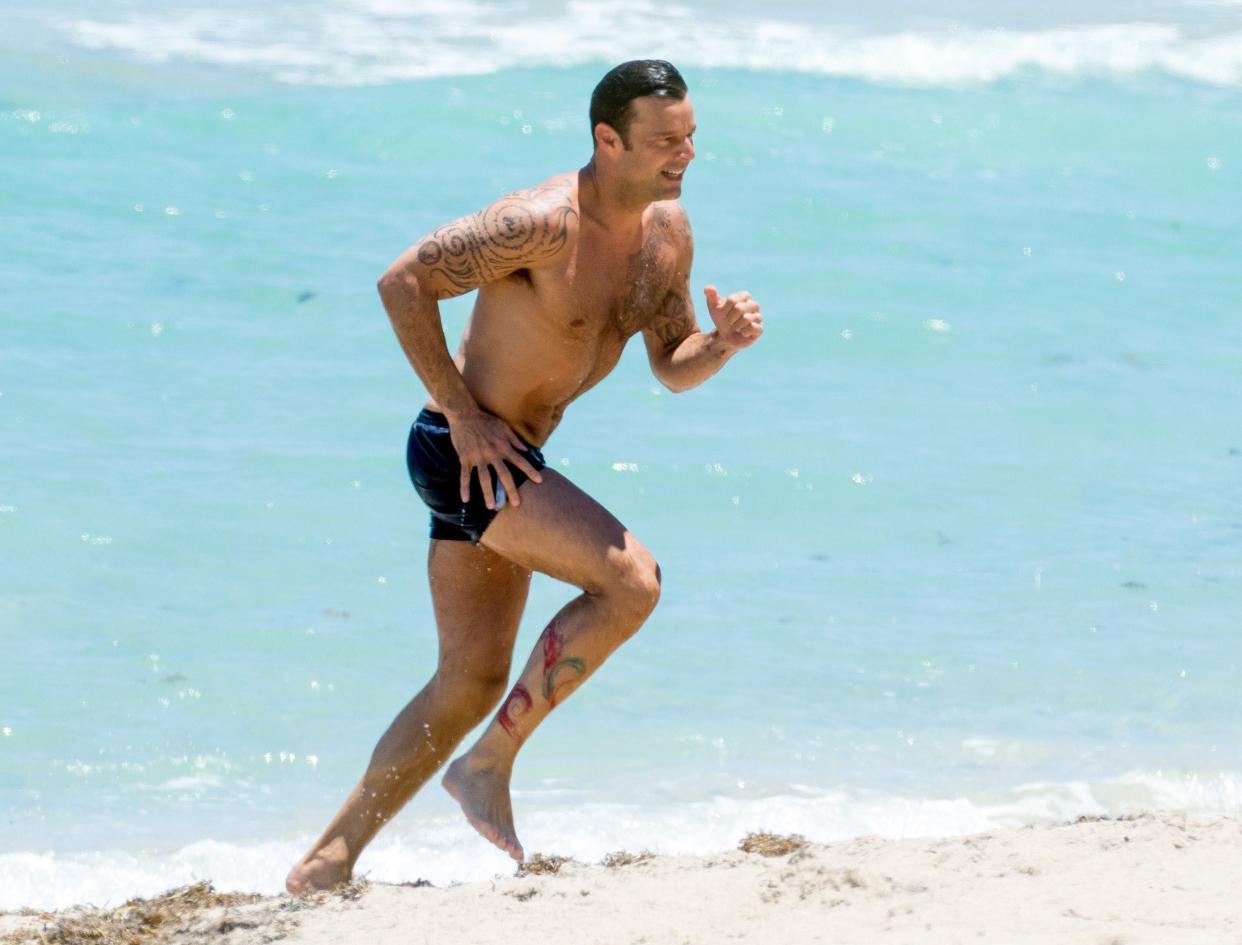 Miami, FL  - *EXCLUSIVE*  - Ricky Martin is seen enjoying a break from filming 'Versace: American Crime Story' by hitting the beach in Miami. Ricky showed off his toned body as he swam in the ocean and jogged back to his seat on the beach. ***SHOT MAY 14, 2017***  Pictured: Ricky Martin  BACKGRID USA 16 MAY 2017   BYLINE MUST READ: OHPIX / BACKGRID  USA: +1 310 798 9111 / usasales@backgrid.com  UK: +44 208 344 2007 / uksales@backgrid.com  *UK Clients - Pictures Containing Children Please Pixelate Face Prior To Publication*