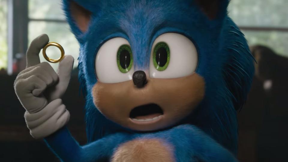 Sonic The Hedgehog holding a gold ring