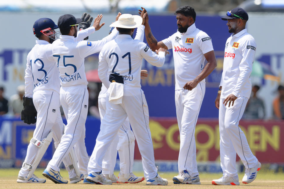 Sri Lanka's Prabath Jayasuriya, second right, celebrates with teammates the wicket of New Zealand's captain Tim Southee on the third day of the first cricket test match between New Zealand and Sri Lanka in Galle, Sri Lanka, Friday, Sept. 20, 2024. (AP Photo/Viraj Kothalawala)