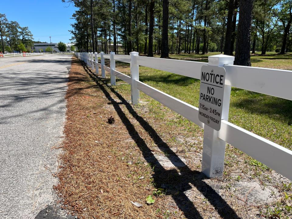 New Hanover County Schools installed fencing at Laney High and Trask Middle in order to improve traffic congestion and pedestrian safety at the two schools. Concerns about congestion and pedestrian safety have increased after a series of vehicle crashes involving pedestrians this school year. MATTHEW PRENSKY/STARNEWS