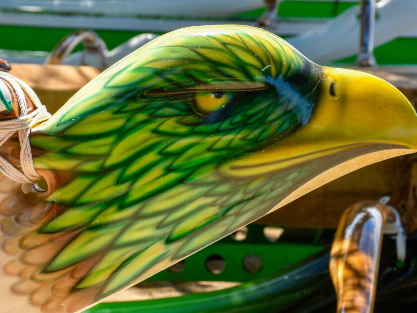 Custom paint job of a bird's head on an outrigger canoe