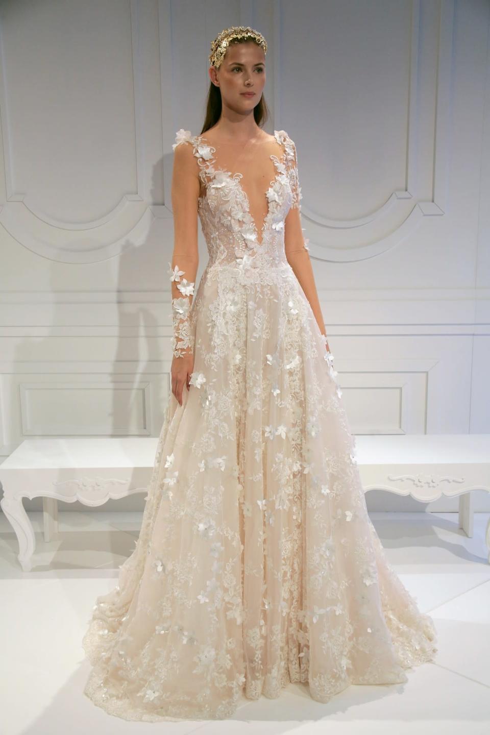 <p>However, Lahav also produced some more classic designs, including this stunning embroidered gown. [Photo: Getty] </p>
