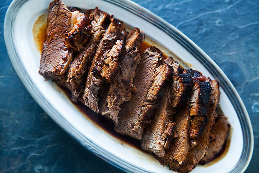 <strong>Get the <a href="http://www.simplyrecipes.com/recipes/beef_brisket/">Beef Brisket</a> recipe from Simply Recipes</strong>  <br><em>(Secret ingredients: soy sauce and time. We love this.)</em>