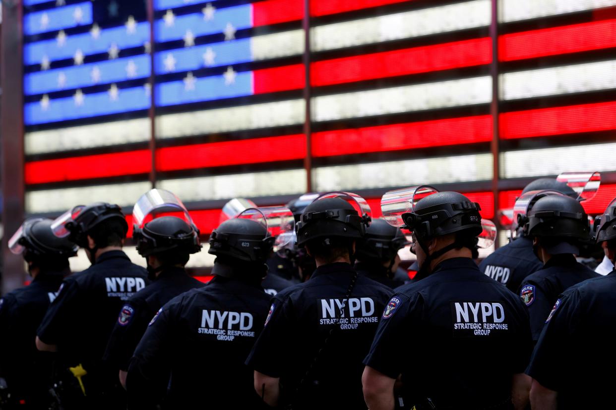 FILE PHOTO: New York Police Department (NYPD) officers are pictured as protesters rally against the death in Minneapolis police custody of George Floyd, in Times Square in the Manhattan borough of New York City, U.S., June 1, 2020. REUTERS/Mike Segar