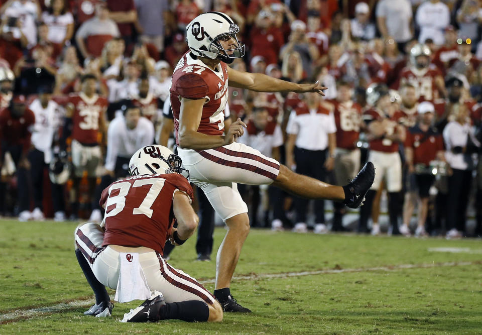 Oklahoma place kicker Gabe Brkic (47) watches as his game winning field goal against West Virginia goes through the goal post during the second half of an NCAA college football game in Norman, Okla., Saturday, Sep. 25, 2021. (AP Photo/Alonzo Adams)