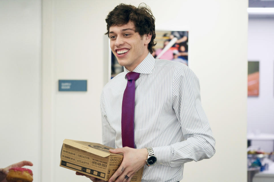 Pete smiling and wearing a shirt and tie