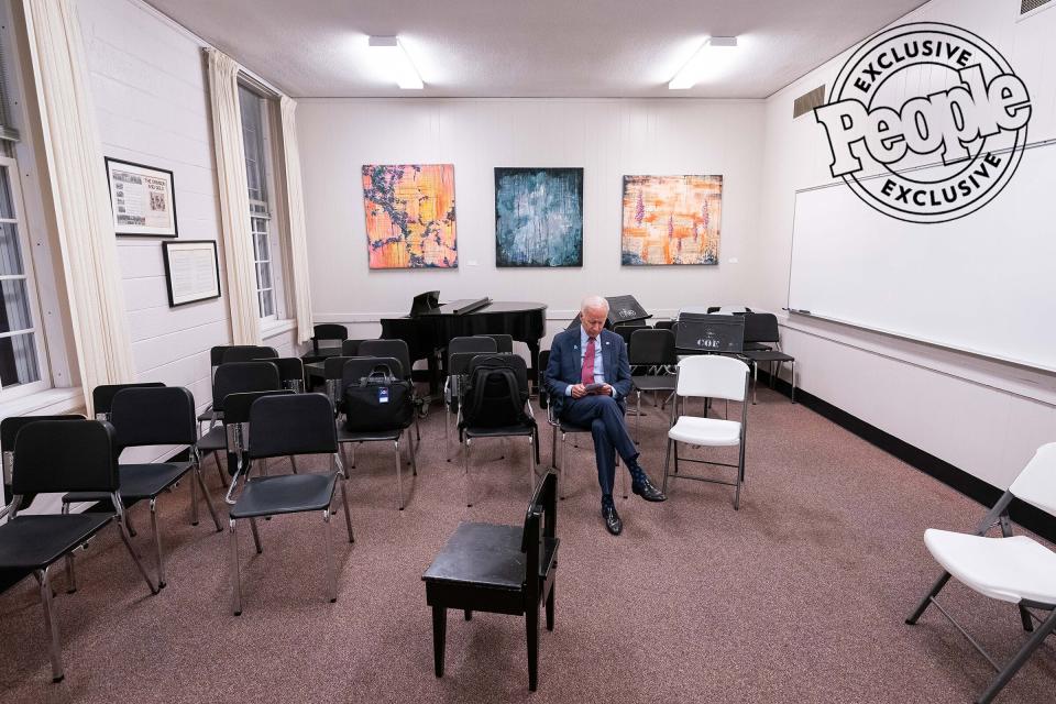 Biden takes a moment to review his notes in a music room while waiting to take the stage at the LGBTQ Presidential Forum at Coe College in Des Moines, Iowa, on Sept. 20, 2019.