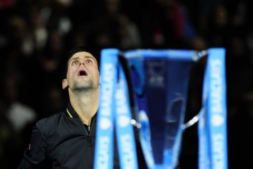 Novak Djokovic produced one of his greatest performances to defeat Roger Federer 7-6 (8/6), 7-5 in the final of the ATP Tour Finals in London. Djokovic has been playing with a heavy heart over the last week at London's O2 Arena as his father Srdjan battles to recover from a blood disorder that struck suddenly a few weeks ago