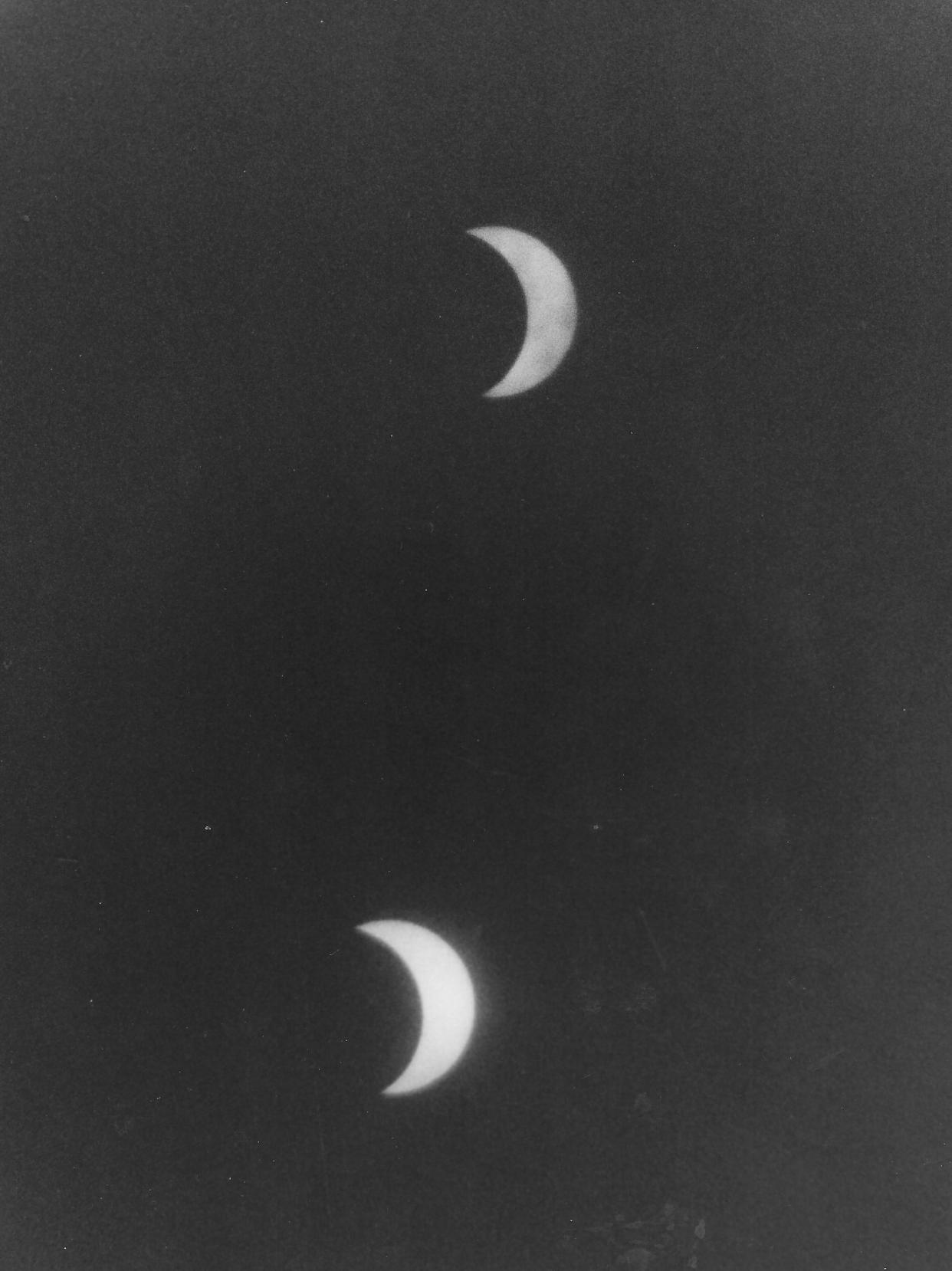 Two shots of the partial solar eclipse over Akron on March 6, 1970, are captured on the same piece of film.
