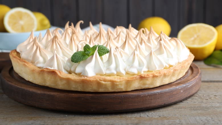 Lemon meringue pie on wooden platform 