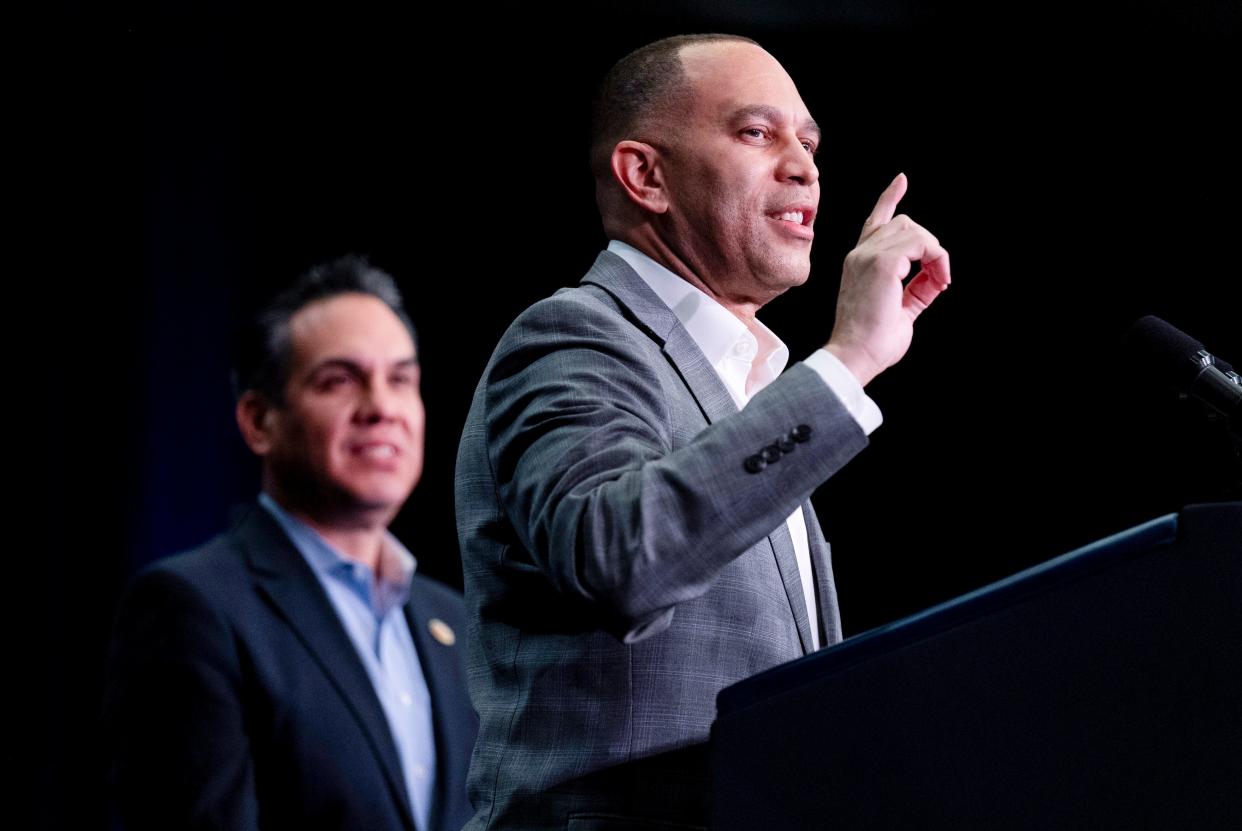 House Minority Leader Hakeem Jeffries, D-N.Y., center, accompanied Democratic Caucus Chair Rep. Pete Aguilar, D-Calif., left, speaks at the House Democratic Caucus Issues Conference at Lansdowne Resort in Leesburg, Va., Thursday, Feb. 8, 2024.