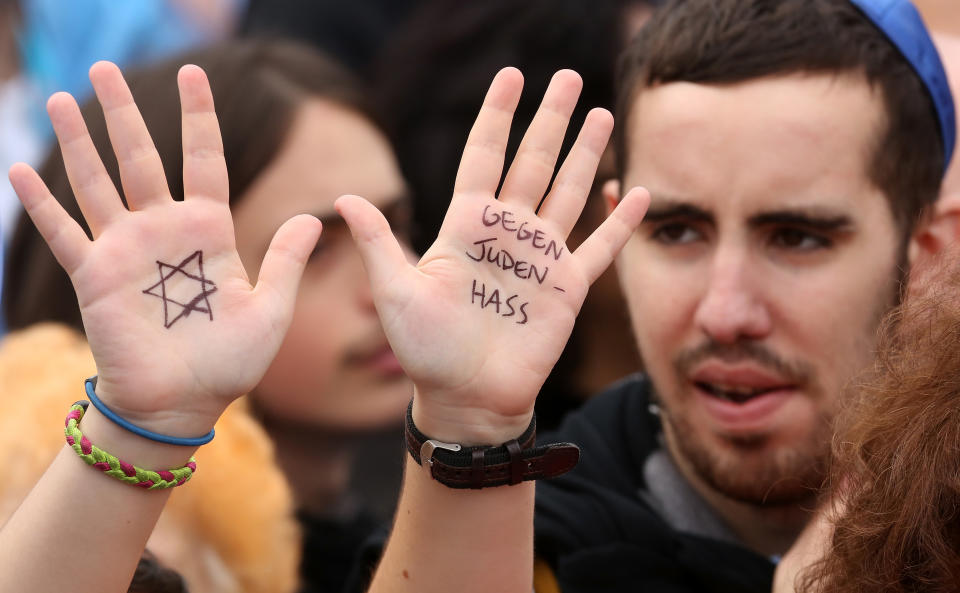 BERLIN, GERMANY - SEPTEMBER 14:  A visitor with with a Star of David and the words 'Against Hatred Toward Jews' written on her hands attends a rally against anti-Semitism on September 14, 2014 in Berlin, Germany. With the slogan 'Stand Up! Never Again Hatred Towards Jews' ('Steh auf! Nie wieder Judenhass'), the Central Council of Jews in Germany (Zentralrat der Juden) organized the demonstration after anti-Semitic incidents in the country occurring in the wake of the conflict in Gaza this summer, in which more than 2,000 Palestinians were killed by the Israeli government, the majority of whom were civilians, according to Palestinian authorities.  (Photo by Adam Berry/Getty Images)