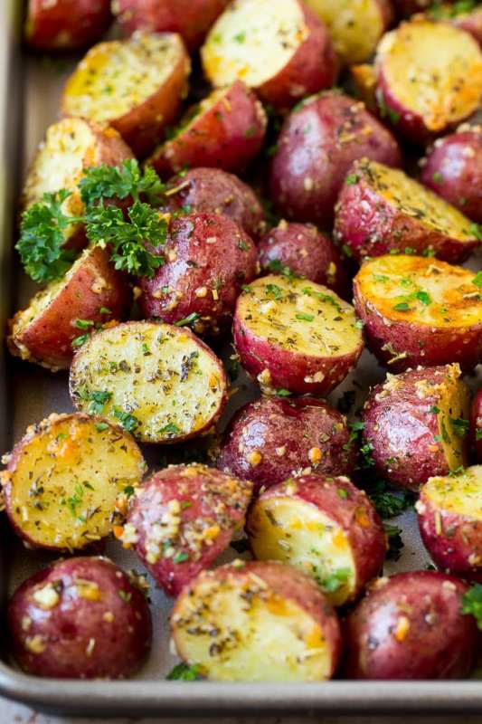 <p>Dinner at the Zoo</p><p>These roasted red potatoes are coated in garlic, herbs and parmesan cheese, then oven baked to golden brown perfection. An easy and elegant side dish that takes just minutes to put together!</p><p><strong>Get the recipe: <a href="https://www.dinneratthezoo.com/roasted-red-potatoes/" rel="nofollow noopener" target="_blank" data-ylk="slk:Roasted Red Potatoes;elm:context_link;itc:0;sec:content-canvas" class="link ">Roasted Red Potatoes</a></strong></p>