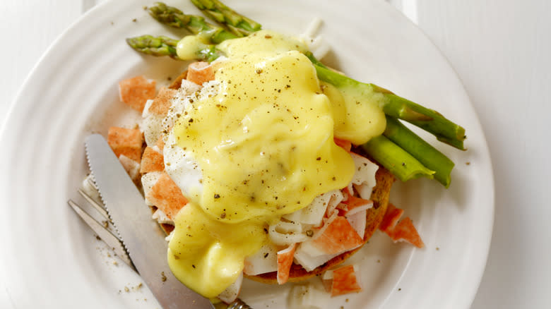 Seafood eggs benedict with asparagus
