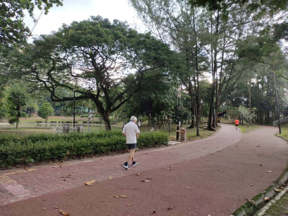 Joggers jogging at Taman Tasik Permaisuri on the first day of CMCO May 4, 2020. — Picture by Kenneth Tee