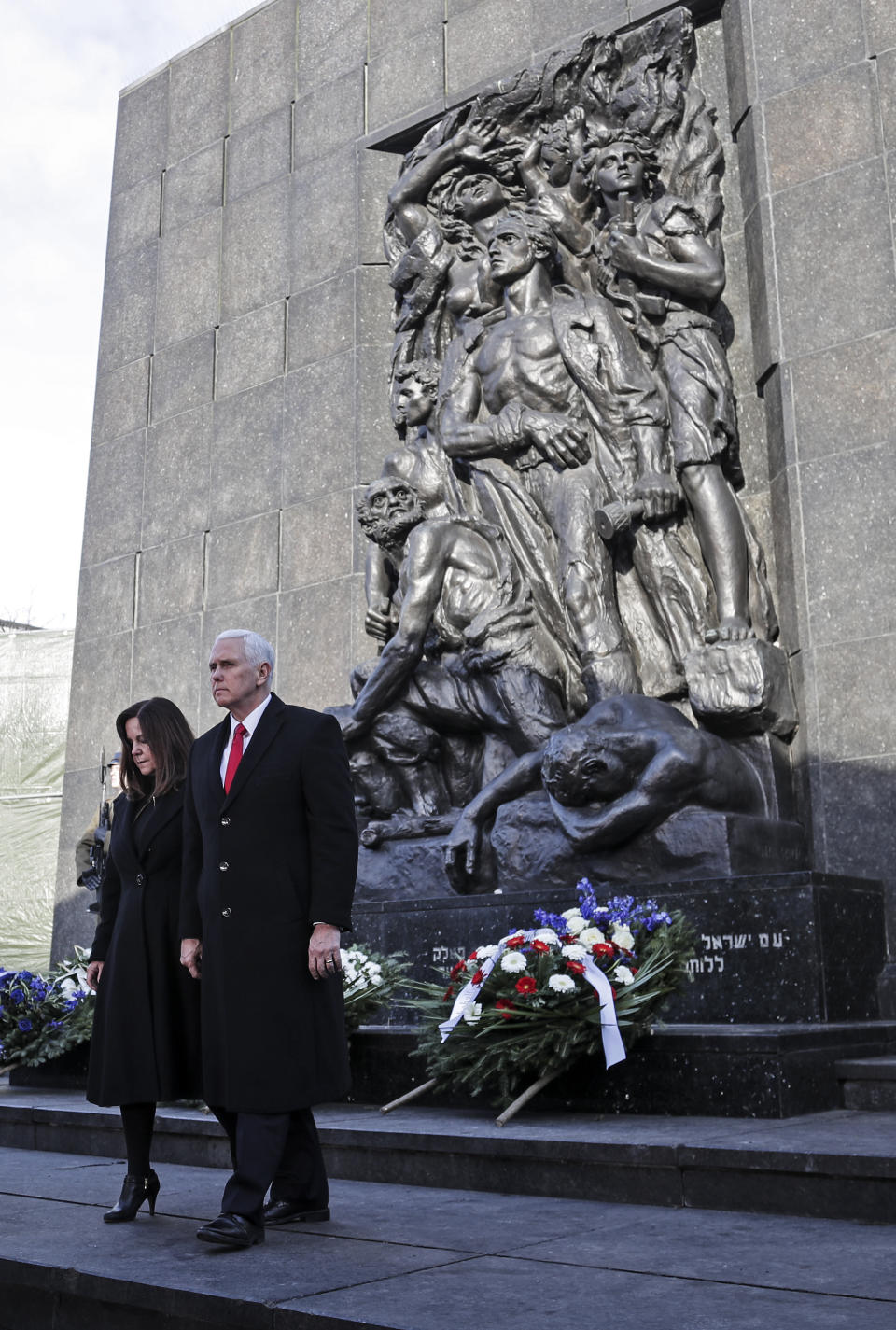 United States Vice President Mike Pence and his wife Karen leave the Monument to the Ghetto Heroes during a wreath laying ceremony in Warsaw, Poland, Thursday, Feb. 14, 2019. The Polish capital is host for a two-day international conference on the Middle East, co-organized by Poland and the United States. (AP Photo/Michael Sohn)