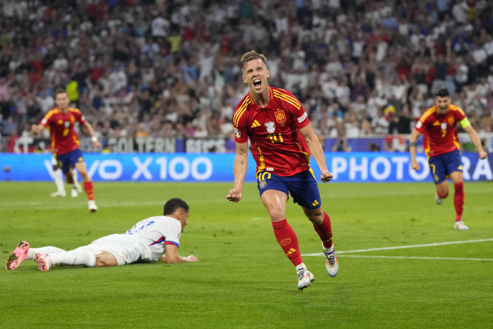 Spain's Dani Olmo celebrates after scoring his side's second goal during a semifinal match between Spain and France at the Euro 2024 soccer tournament in Munich, Germany, Tuesday, July 9, 2024. (AP Photo/Manu Fernandez)