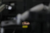 A currency trader watches computer monitors at the foreign exchange dealing room in Seoul, South Korea, Monday, May 25, 2020. Asian shares are mostly higher, with Tokyo stocks gaining on expectations that a pandemic state of emergency will be lifted for all of Japan. But shares fell in Hong Kong on Monday after police used tear gas to quell weekend protests over a proposed national security bill for the former British colony. (AP Photo/Lee Jin-man)