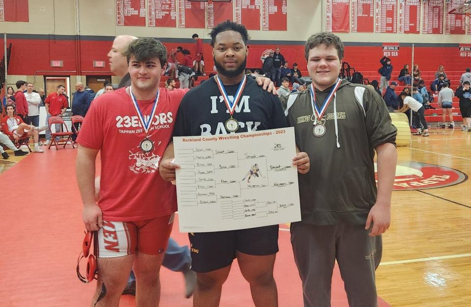 Clarkstown North's Justin Smoot (center) won the 2023 Rockland County 285-pound title. He's joined by second-place finisher Luke Hermann of Tappan Zee (left) and third-place finisher John Brew of Clarkstown South (right).