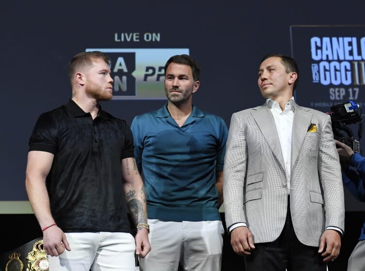 HOLLYWOOD, CA - JUNE 24: Boxer Canelo Alvarez (L) and Gennady Golovkin (R) stare at each other.