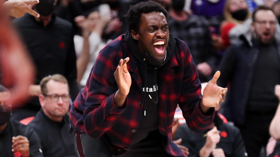 Pascal Siakam celebrates from the sidelines as he rehabs a shoulder procedure. (Richard Lautens/Toronto Star via Getty Images)