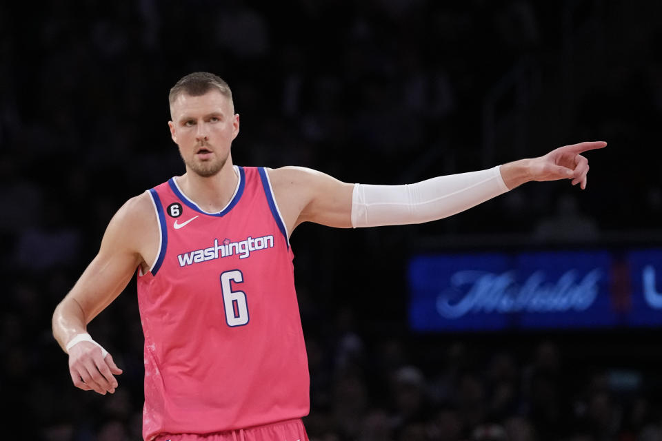 Washington Wizards center Kristaps Porzingis gestures after shooting a 3-point basket during the second half of the team's NBA basketball game against the New York Knicks, Wednesday, Jan. 18, 2023, at Madison Square Garden in New York. The Wizards won 116-105. (AP Photo/Mary Altaffer)