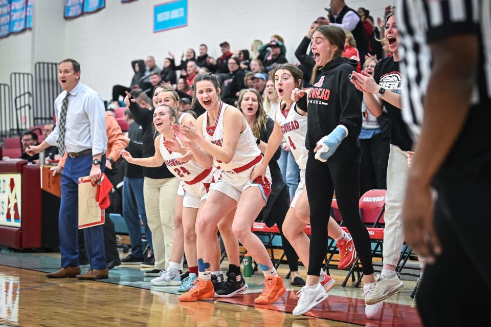 Arrowhead players celebrate after a basket with 2.5 seconds gave them a 69-68 lead over Neenah in a game Dec. 5 at Arrowhead. The Warhawks, No. 2 in this week's rankings, held on to win.