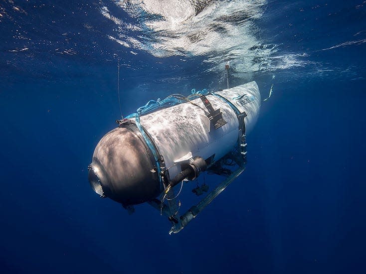 A side view of the Titan submersible in water.