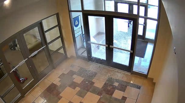 PHOTO: A still image from surveillance video shows Nashville police describe as mass shooting suspect Audrey Elizabeth Hale, firing through glass doors at an entrance to The Covenant School in Nashville, Tenn., March 27, 2023. (Metropolitan Nashville Police)