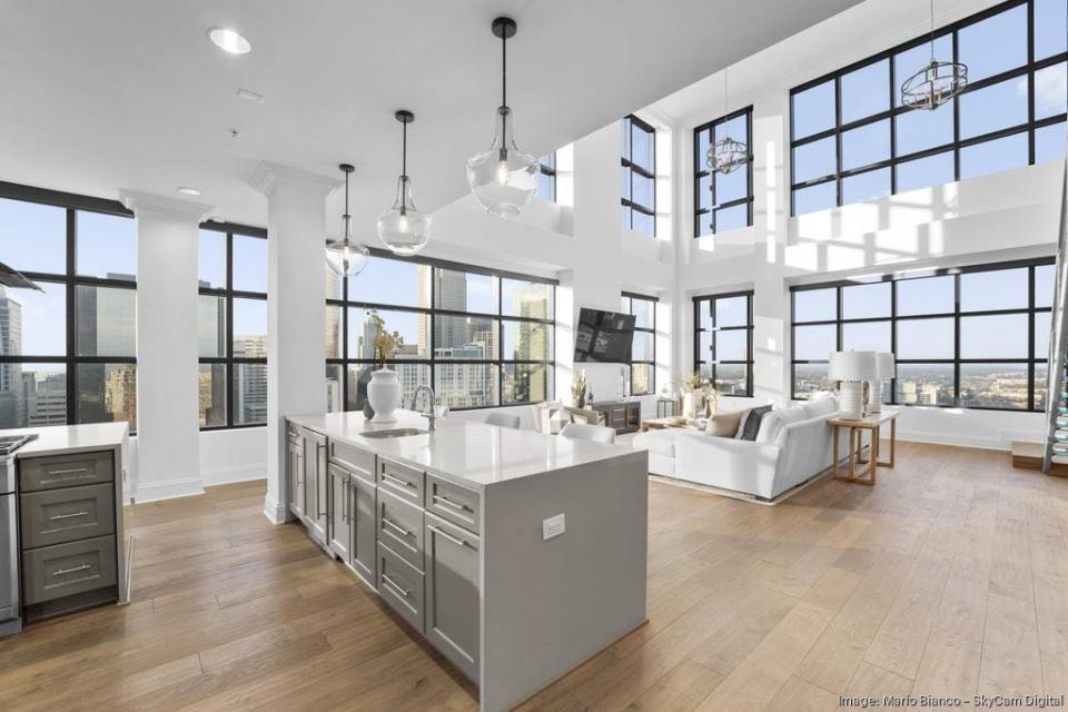 Former Carolina Panthers running back Christian McCaffrey is listing his penthouse in uptown Charlotte's Skye Condominiums building for $3.75 million