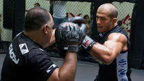 Former UFC heavyweight champion Junior dos Santos hits the mitts during a training session. (Getty)