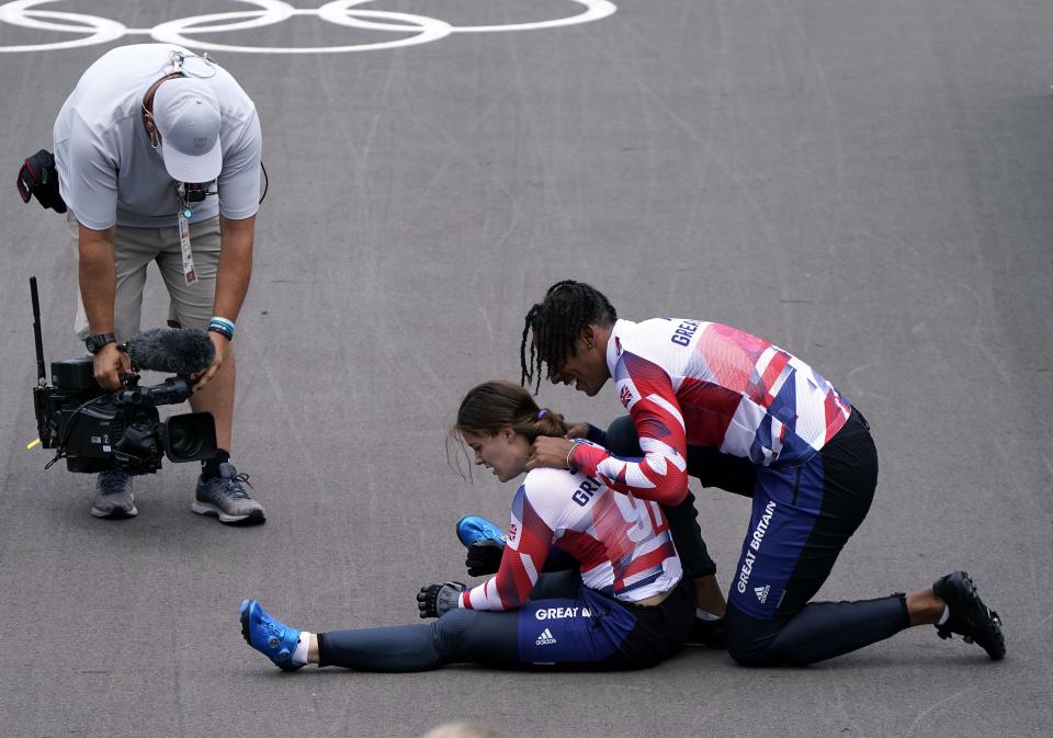 Kye Whyte with Beth Shriever after she collapsed on the track in relief after her gold medal ride (Danny Lawson/PA) (PA Wire)