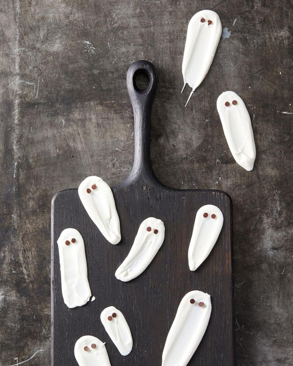 <p>These might be a little bit more "candy" than "cookie," but they are every bit as bite-sized and delicious.</p><p><em><a href="https://www.goodhousekeeping.com/food-recipes/party-ideas/a28591376/white-chocolate-ghosts-recipe/" rel="nofollow noopener" target="_blank" data-ylk="slk:Get the recipe for White Chocolate Ghosts »;elm:context_link;itc:0;sec:content-canvas" class="link ">Get the recipe for White Chocolate Ghosts »</a></em></p>