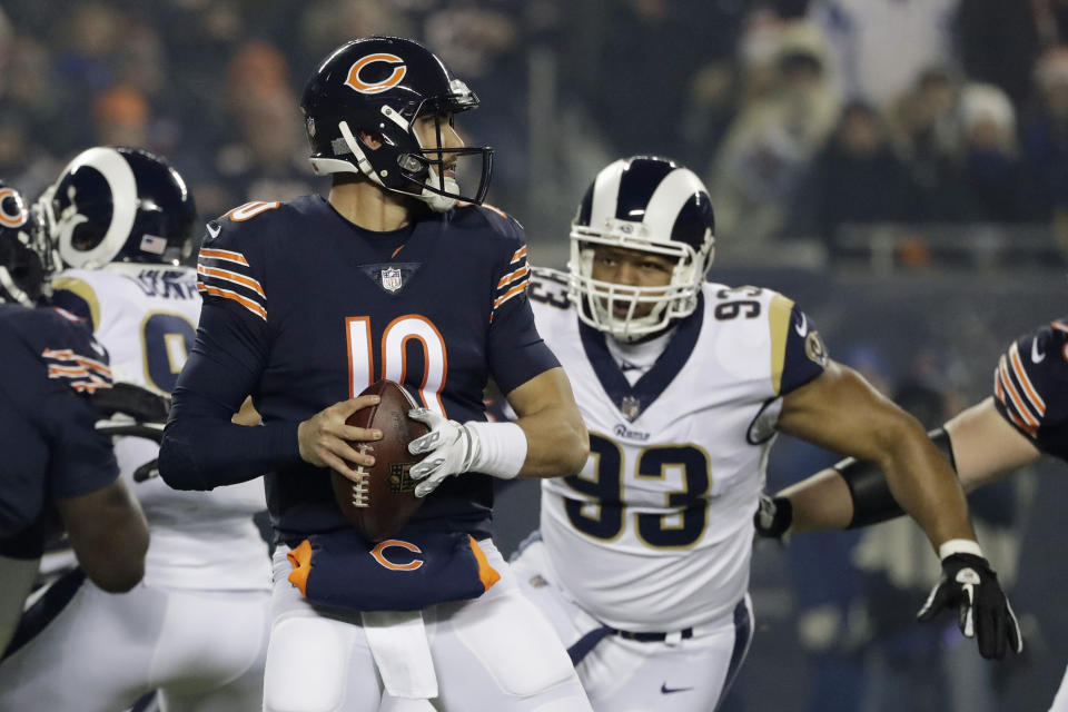 Chicago Bears quarterback Mitchell Trubisky (10) looks for a receiver as Los Angeles Rams nose tackle Ndamukong Suh (93) pressures him during the first half of an NFL football game Sunday, Dec. 9, 2018, in Chicago. (AP Photo/Nam Y. Huh)