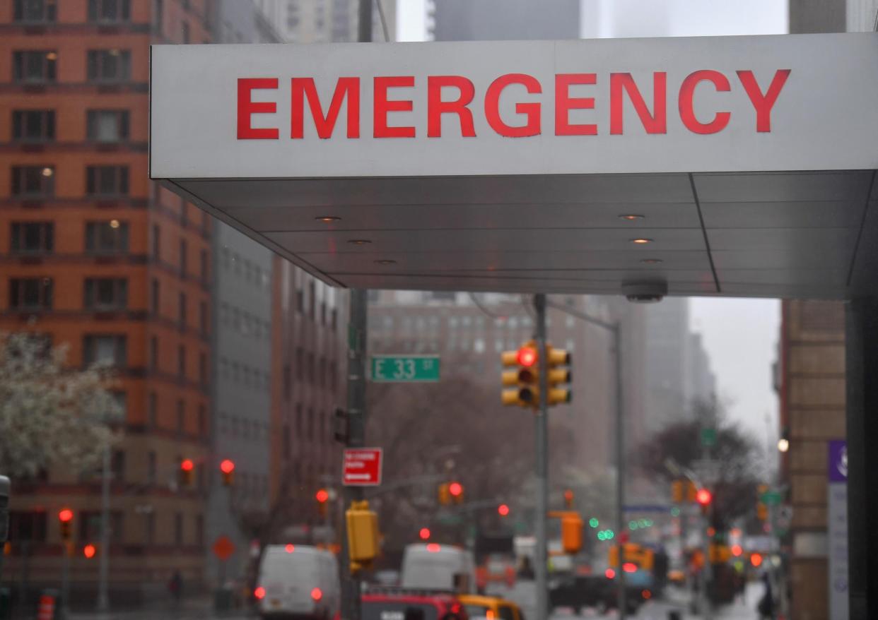 A sign is seen at the NYU Langone Health Center hospital emergency room entrance on March 23, 2020 in New York City. - Anxiety ratcheted up across New York, the epicenter of America's coronavirus pandemic, Monday with streets eerily quiet at the start of the working week as officials warn the crisis will worsen.As the number of deaths in the United States from COVID-19 soars towards 500, the Big Apple finds itself at Ground Zero in the fight to stem the fast-breaking outbreak. (Photo by Angela Weiss / AFP) (Photo by ANGELA WEISS/AFP via Getty Images): Getty Images